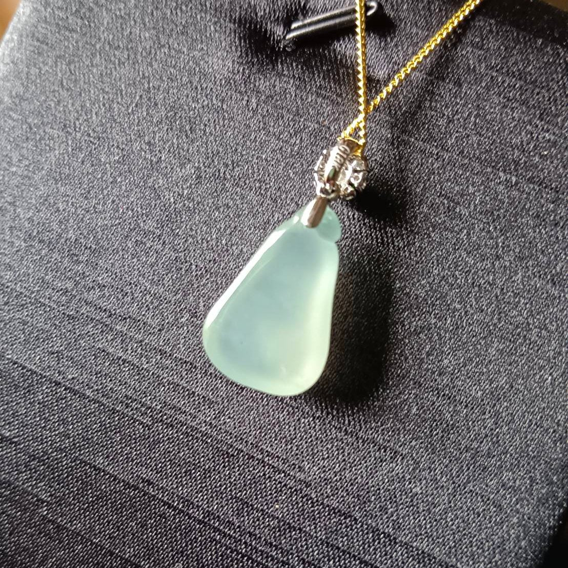 #818 AGL Certified Natural Semi-Transparent Burma Jadeite, Fu Gua 福瓜 Pendant, 18KG Bail with an Imperial Green Cabochon, and Diamonds