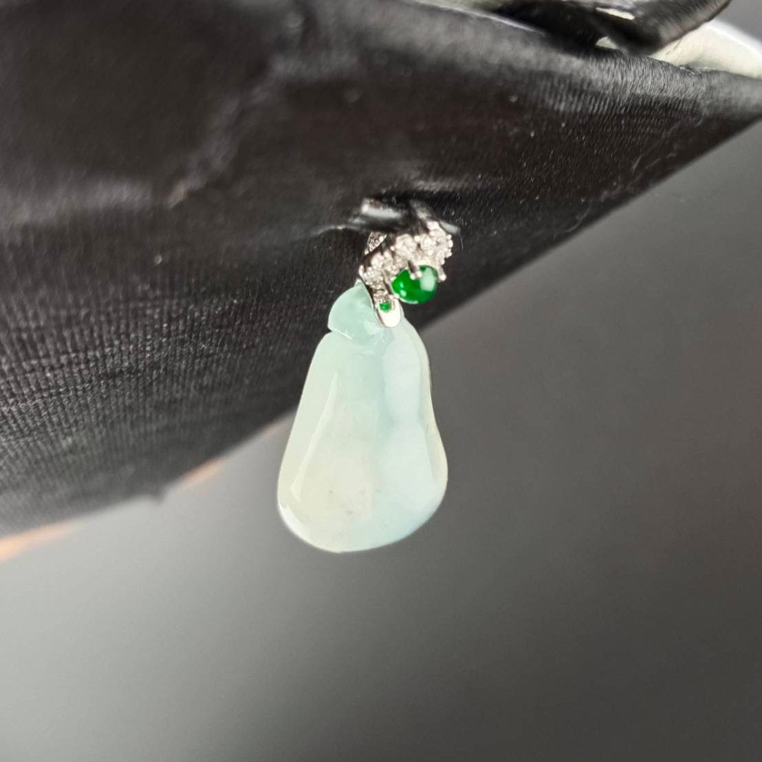 #818 AGL Certified Natural Semi-Transparent Burma Jadeite, Fu Gua 福瓜 Pendant, 18KG Bail with an Imperial Green Cabochon, and Diamonds