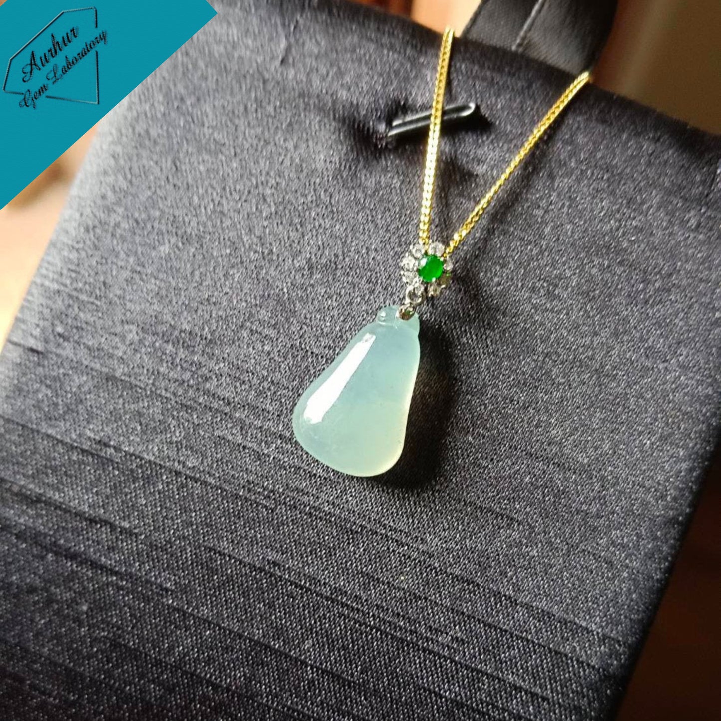 #818 AGL Certified Natural Semi-Transparent Burma Jadeite, Fu Gua 福瓜 Pendant, 18KG Bail with an Imperial Green Cabochon, and Diamonds